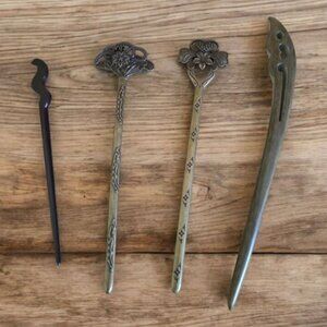 Do-dads ... hair up-do's or shawls Two center ones are metal